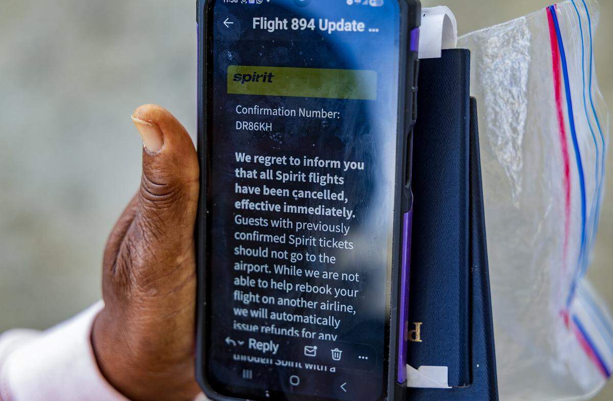 View of a message that passenger Esteen Henry received announcing the cancellation of her flight back home to St. Thomas after Spirit Airlines ceased all its global operations. Henry was at Fort Lauderdale-Hollywood International Airport on Saturday, May 2, 2026.